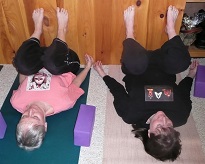 Maretta and Citrini in Knees to Chest at wall